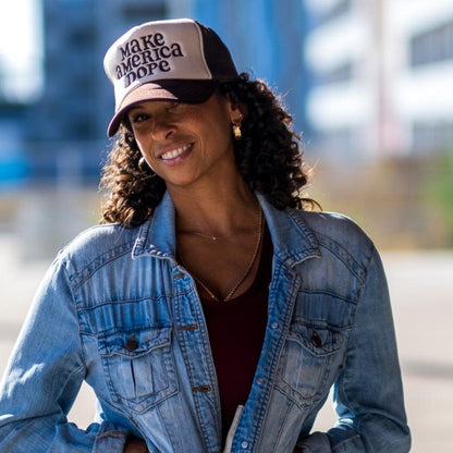 Woman wearing make america dope hat